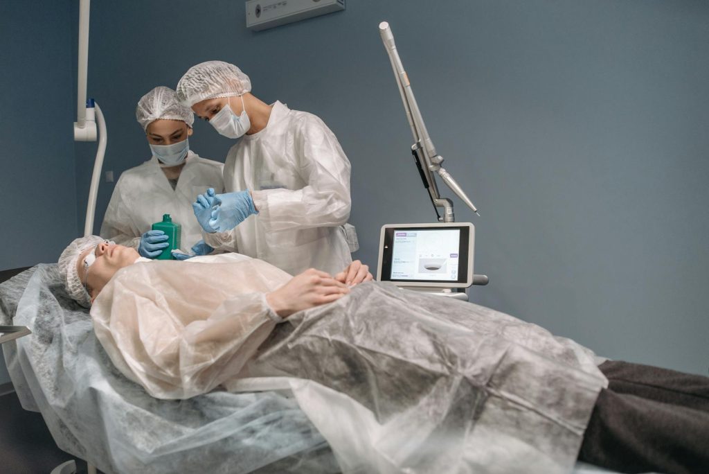 doctors looking at patient on bed in operating room